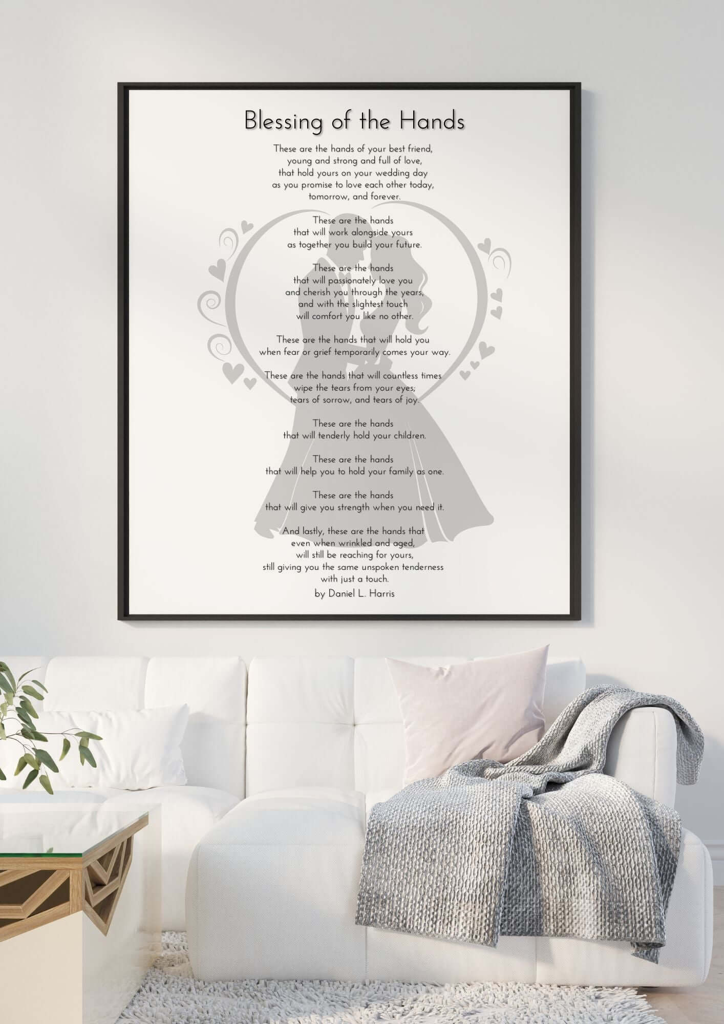 Framed 'Blessing of the Hands Wedding Poem' artwork on wall above a modern white sofa, perfect for wedding ceremonies or romantic gifts.