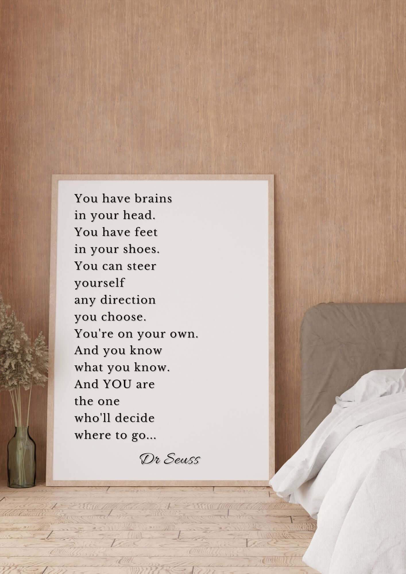 Framed Dr. Seuss Inspirational Quote Printable wall art displayed in cozy bedroom setting.
