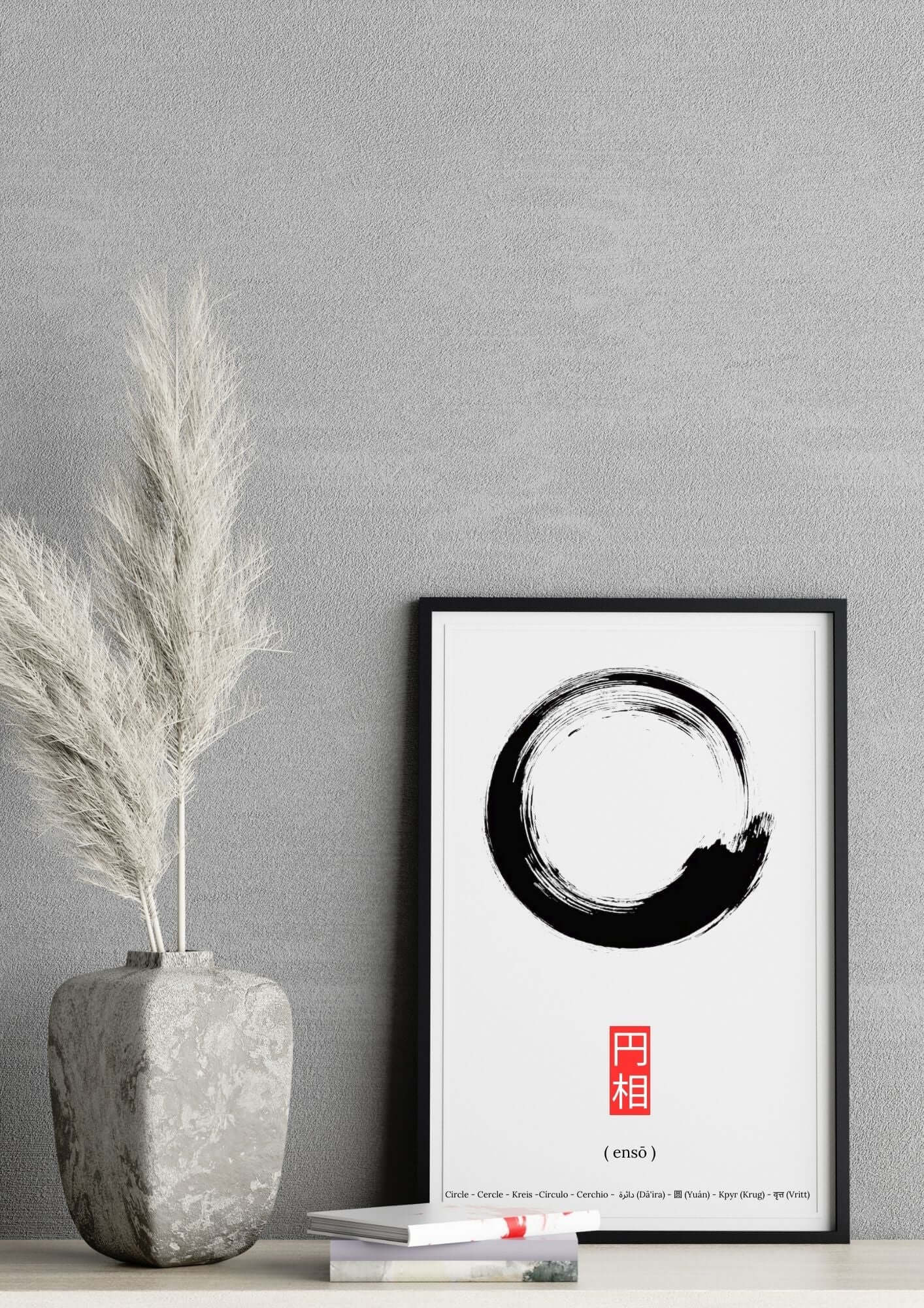 Ensō Circle Zen Art Printable in black brush stroke style, framed and displayed on a shelf for minimalist and modern decor.