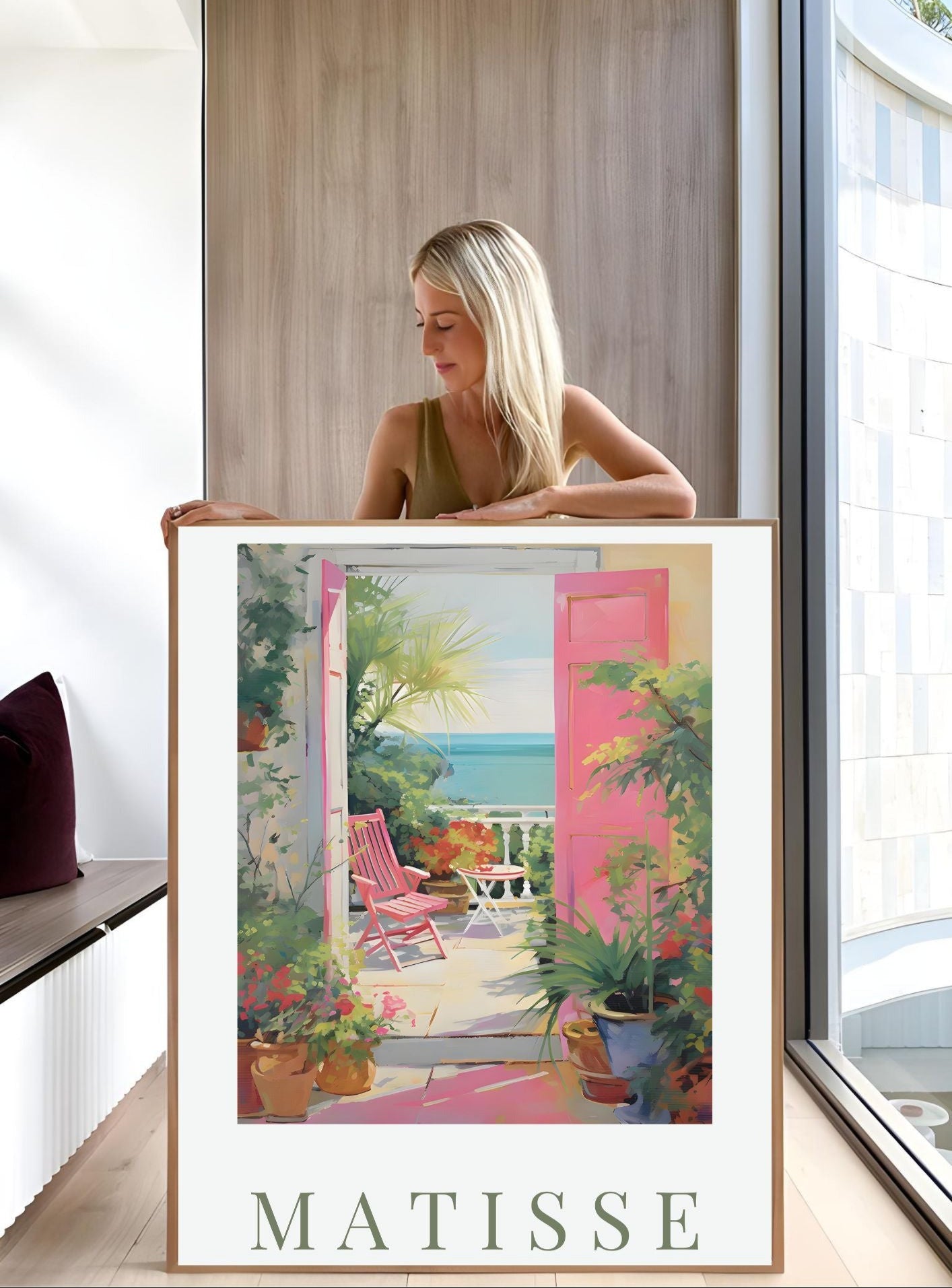 Woman holding Matisse-Inspired Seaside Balcony Print | Mediterranean Digital Wall Art featuring vibrant terrace and sea view.