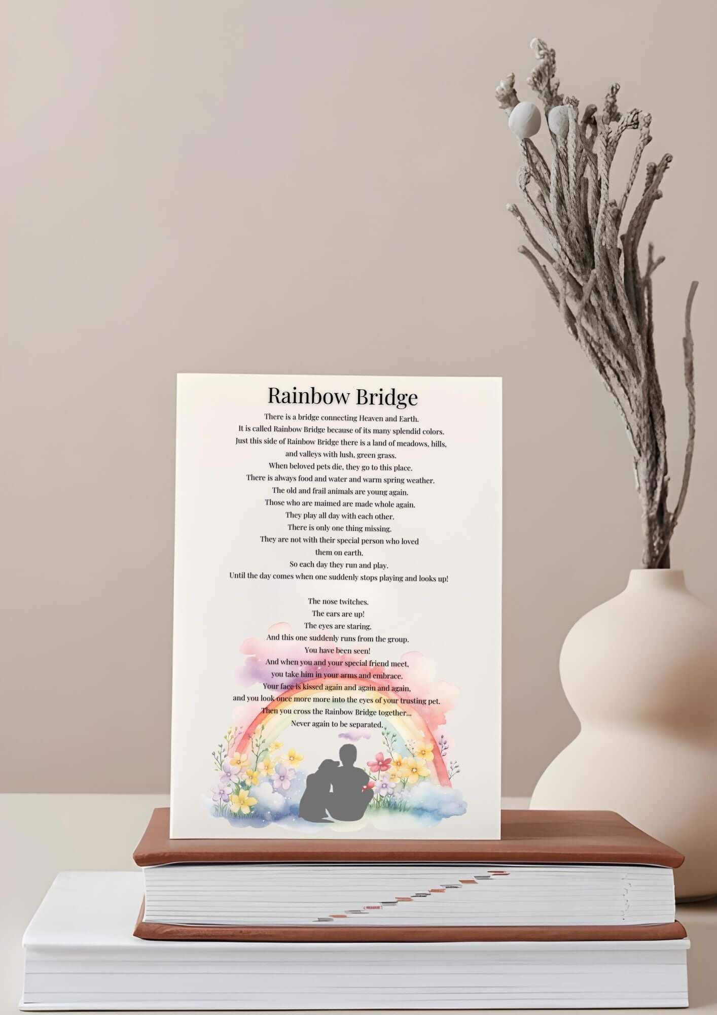 Rainbow Bridge Heartfelt Pet Memorial Poem printable sympathy gift on a tabletop with a vase in the background.