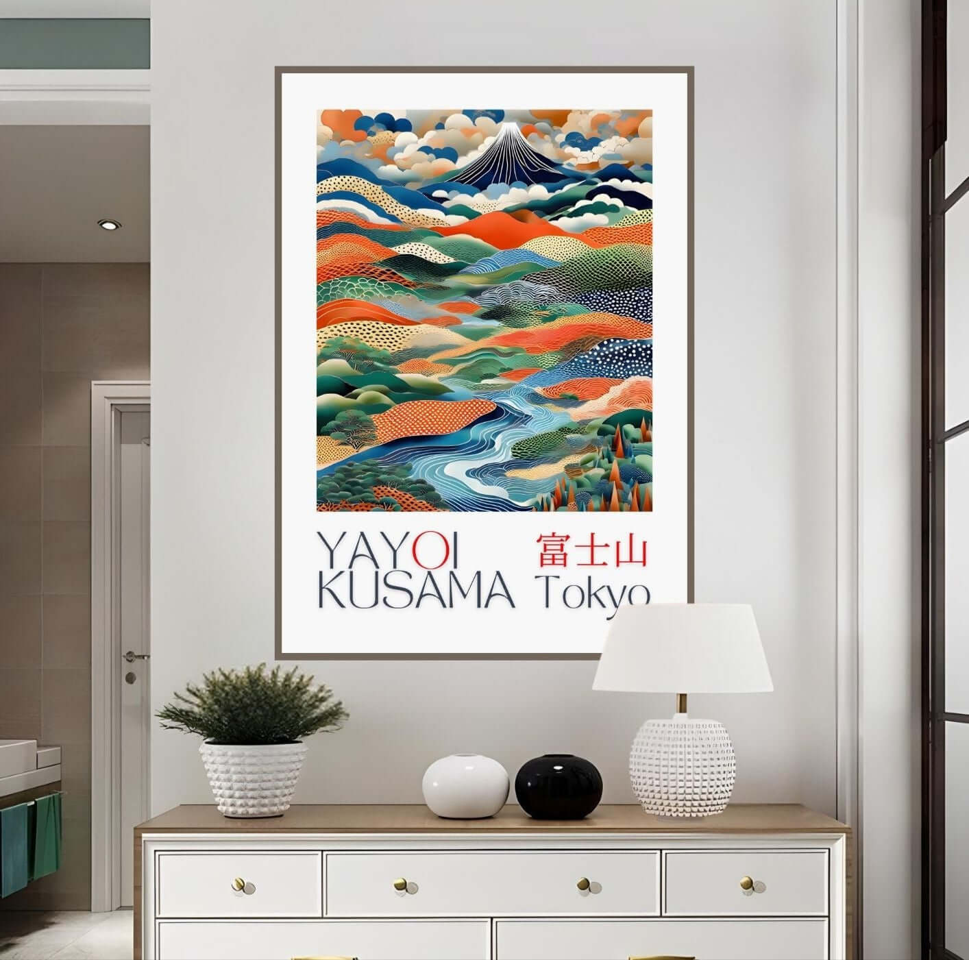 Japanese Landscape Art Print Yayoi Kusama Inspired hanging on a wall above a decorative table, features vibrant dots and a Mount Fuji scene.