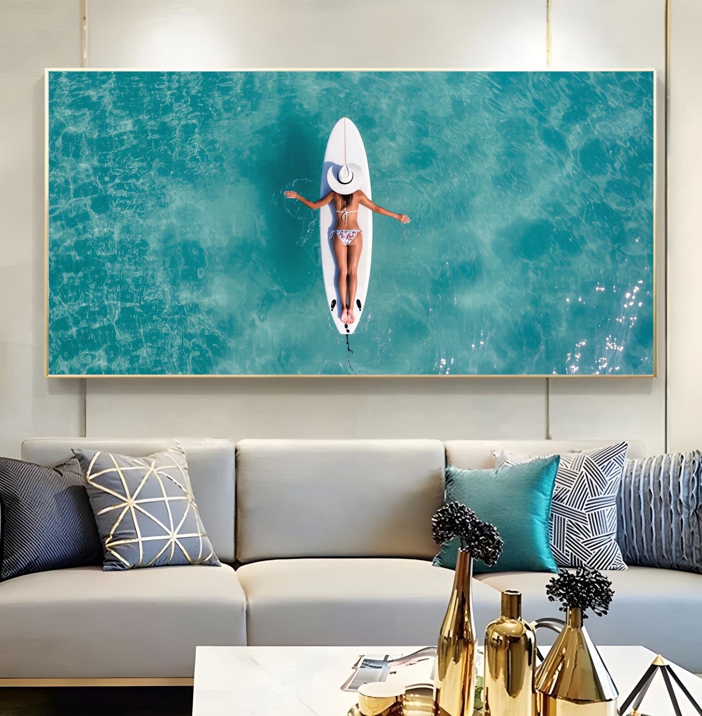 Surfboard Woman Aerial Ocean Print – Minimalist Beach Wall Art depicting a serene top view of a woman on a surfboard in turquoise waters.