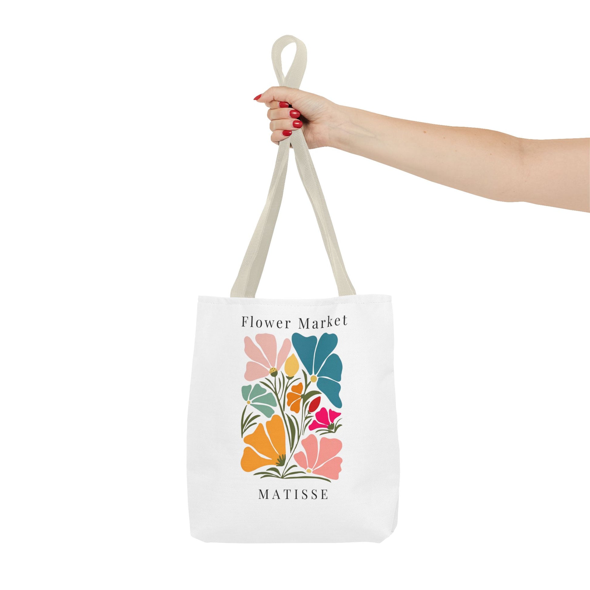 Henri Matisse tote bag with colorful artistic floral design held in hand, perfect for art lovers seeking creativity in everyday life.
