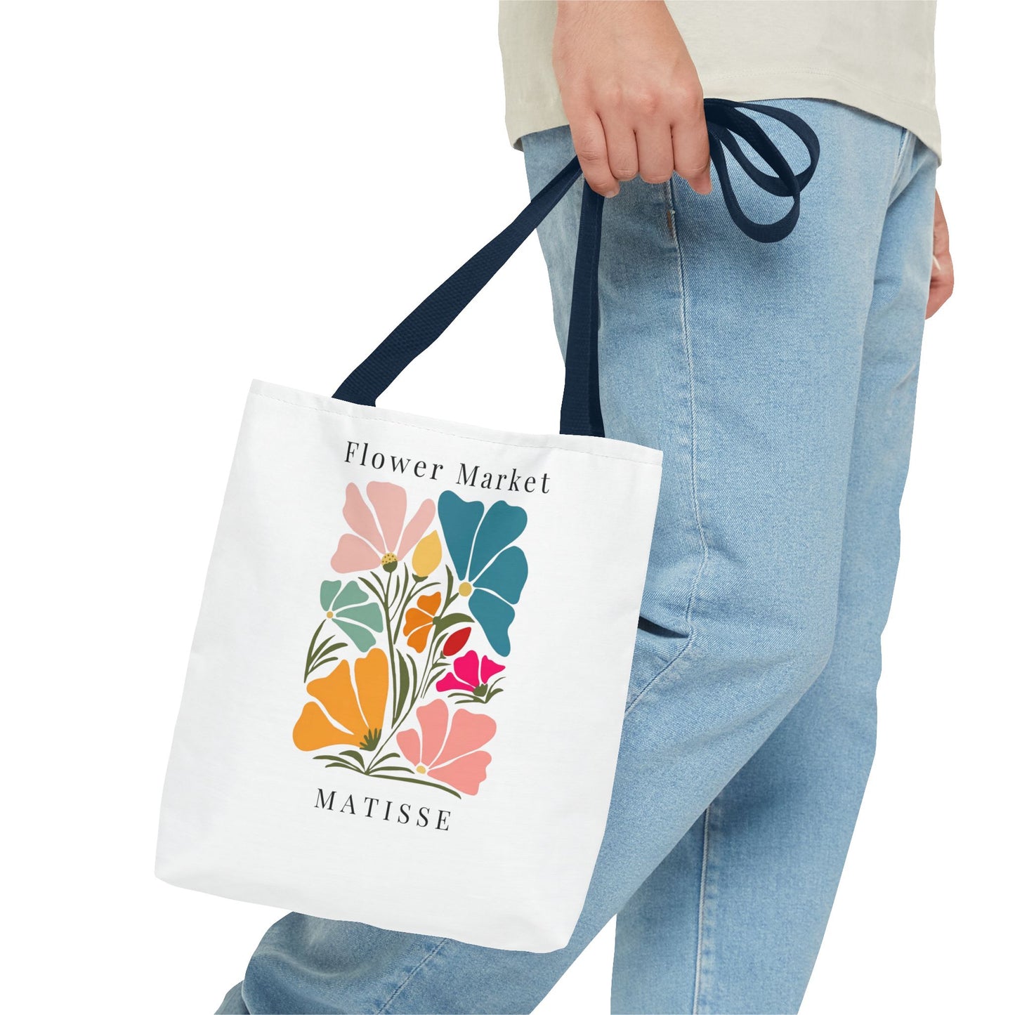 Henri Matisse tote bag with colorful abstract flower design, carried by a person in jeans. Ideal for art lovers who adore creative elegance.