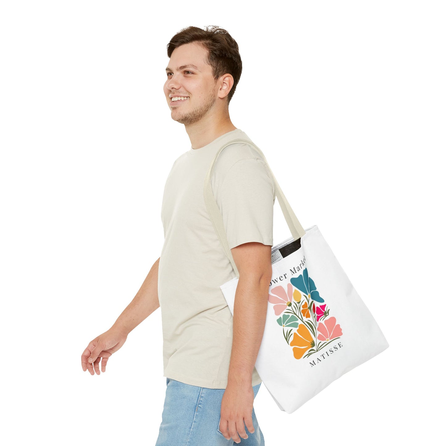 Young man carrying Henri Matisse tote bag with vibrant artistic design
