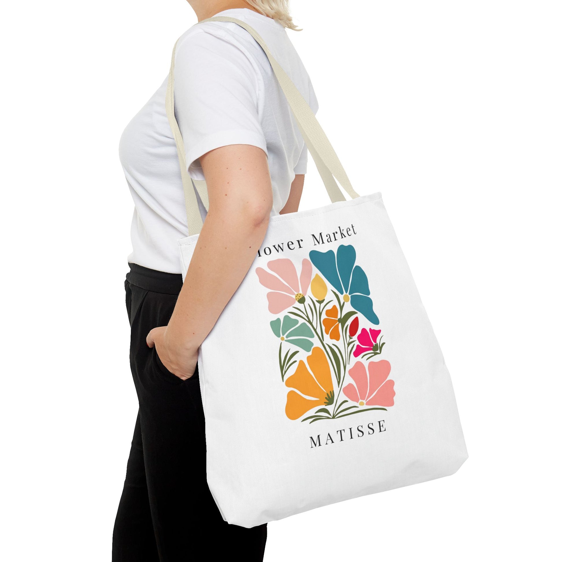 Henri Matisse tote bag with vibrant floral artistic design carried by a person, perfect for art lovers seeking style and practicality.