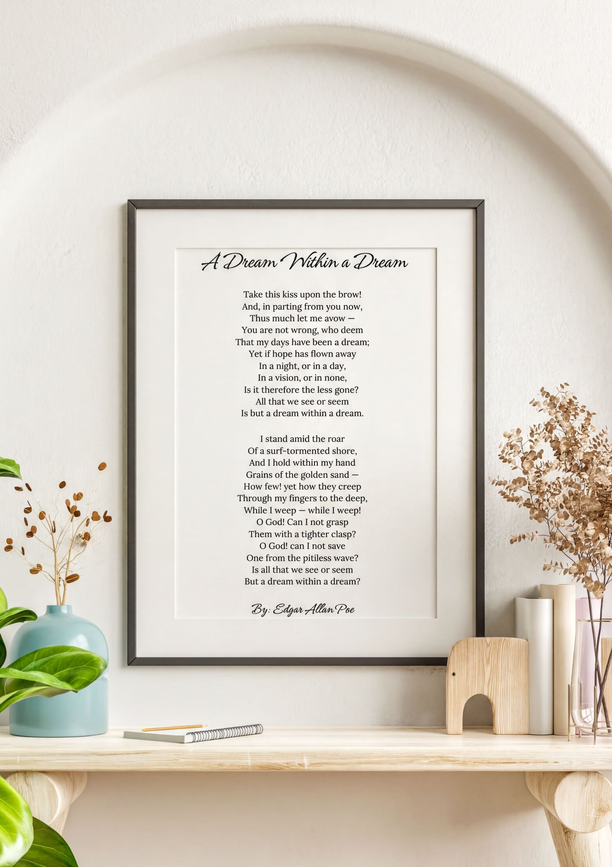 Edgar Allan Poe Print featuring the poem 'A Dream Within a Dream' in an elegant frame on a wall.