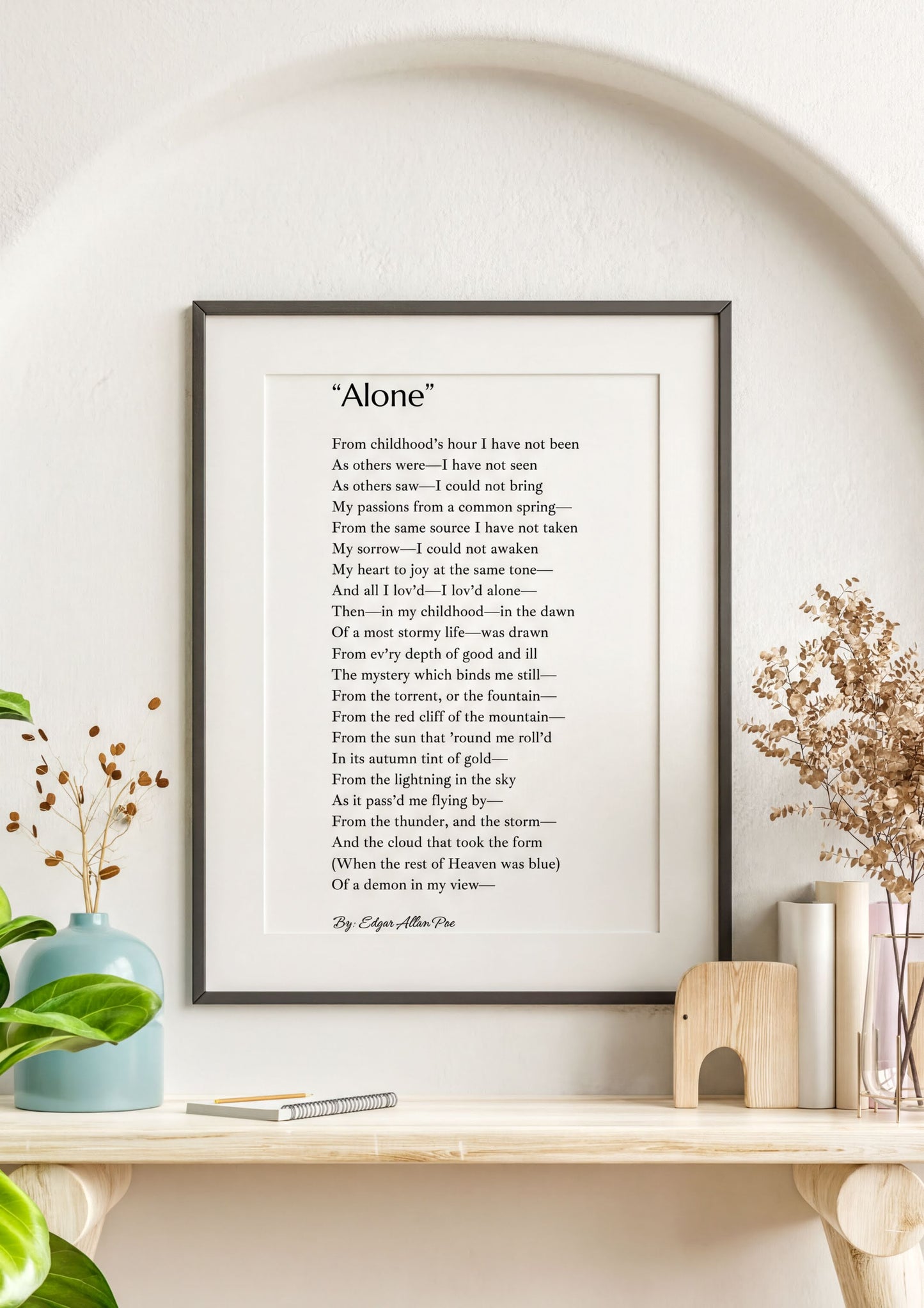 Alone Edgar Allan Poe Print displayed in a minimalist frame, featuring the poem 'Alone' on a decorative wall.
