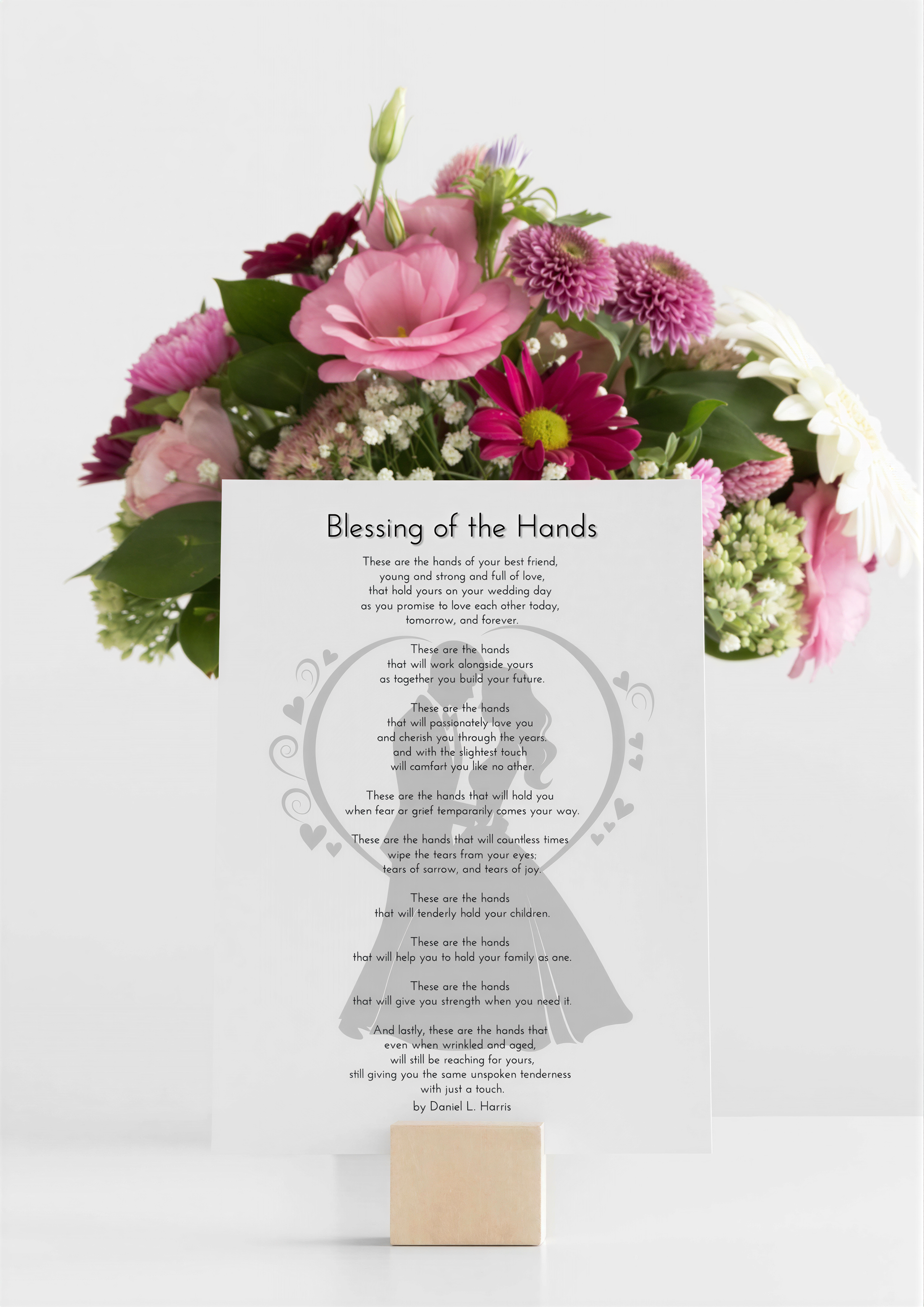 Wedding Blessing Poem displayed with vibrant floral arrangement on a stand, celebrating love and unity.