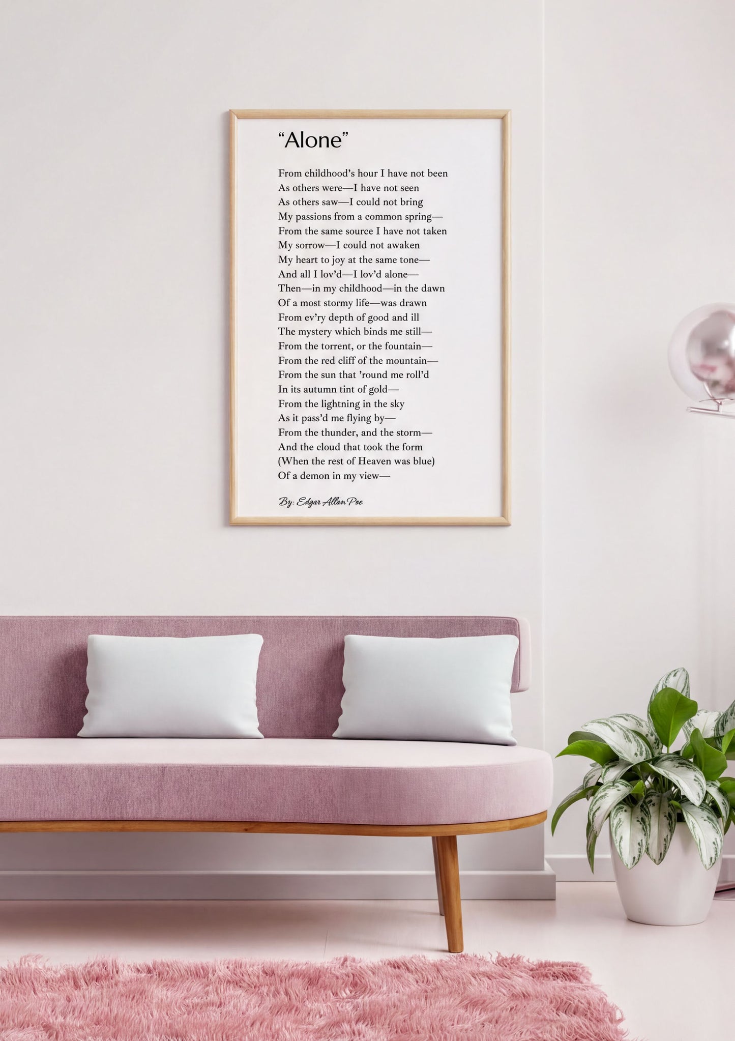 Alone Edgar Allan Poe Print displayed in a stylish living room with pink decor and minimalist design.