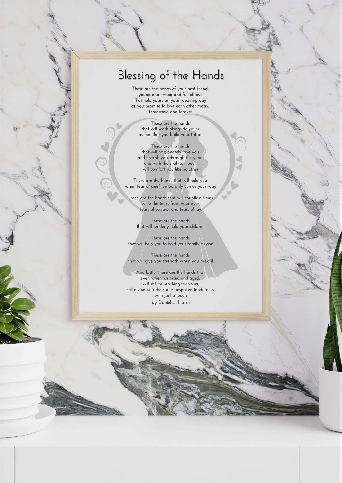 Wedding Blessing Poem displayed in elegant frame on marble wall background with plants.