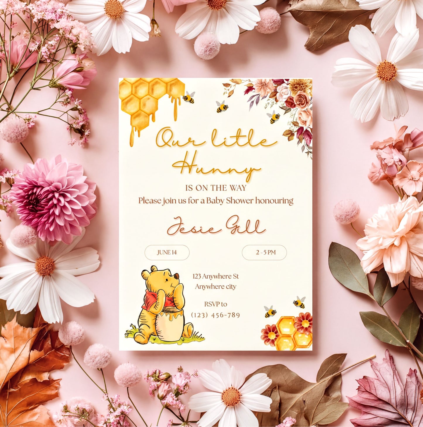 Winnie the Pooh Invitation showcasing floral design and honeycomb accents for a baby shower celebration.