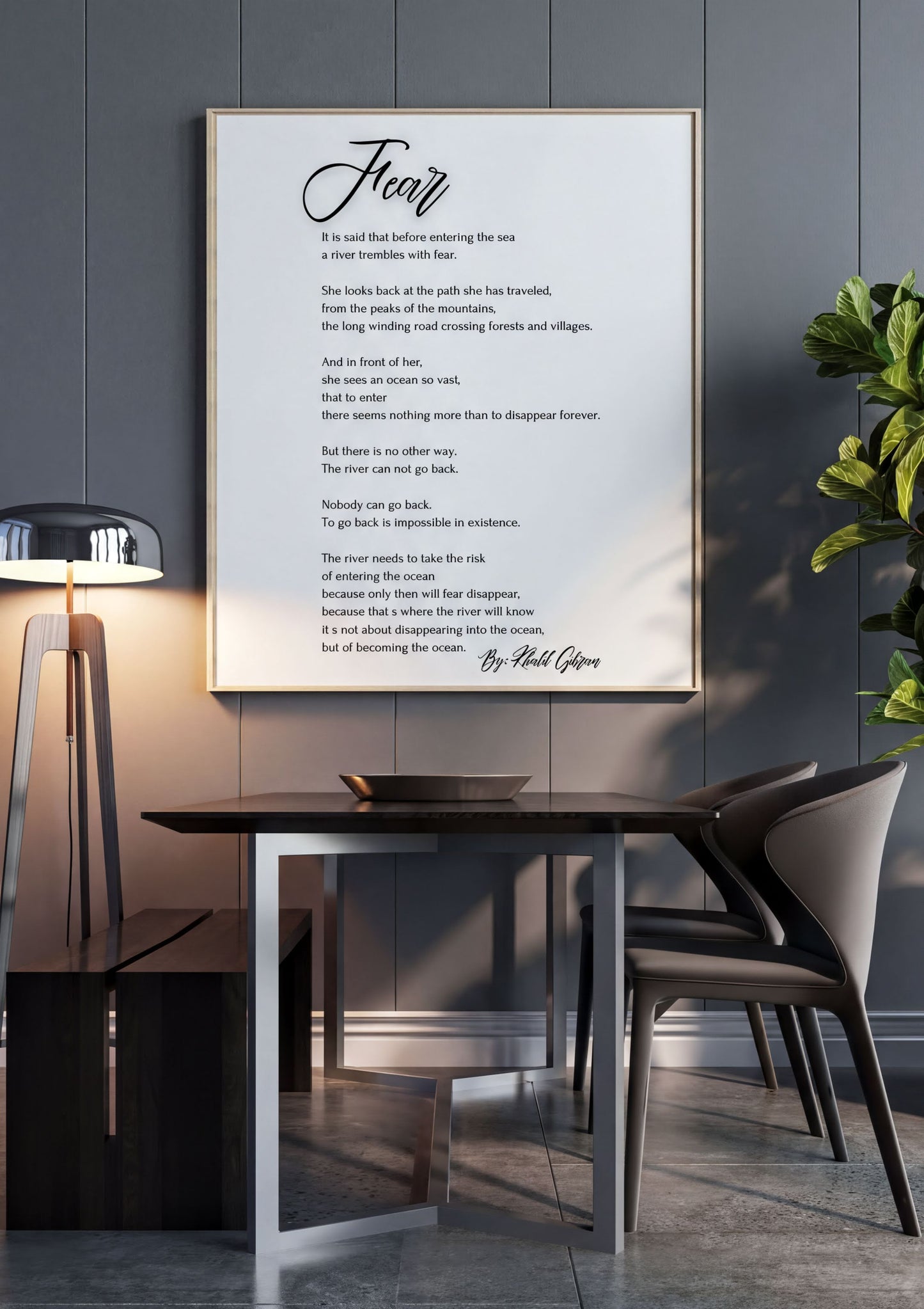 "Fear - Khalil Gibran Poem Print" framed on a wall above a modern dining table.