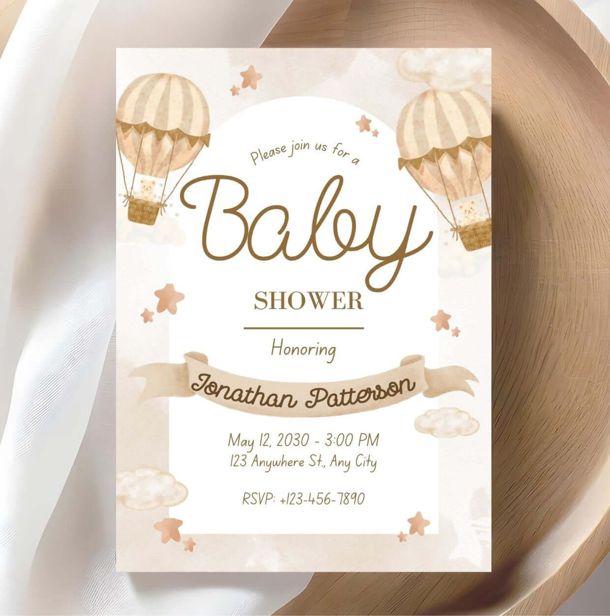 Beige baby shower invitation with hot air balloon design, featuring watercolor tones and rustic elegance for gender-neutral celebrations.