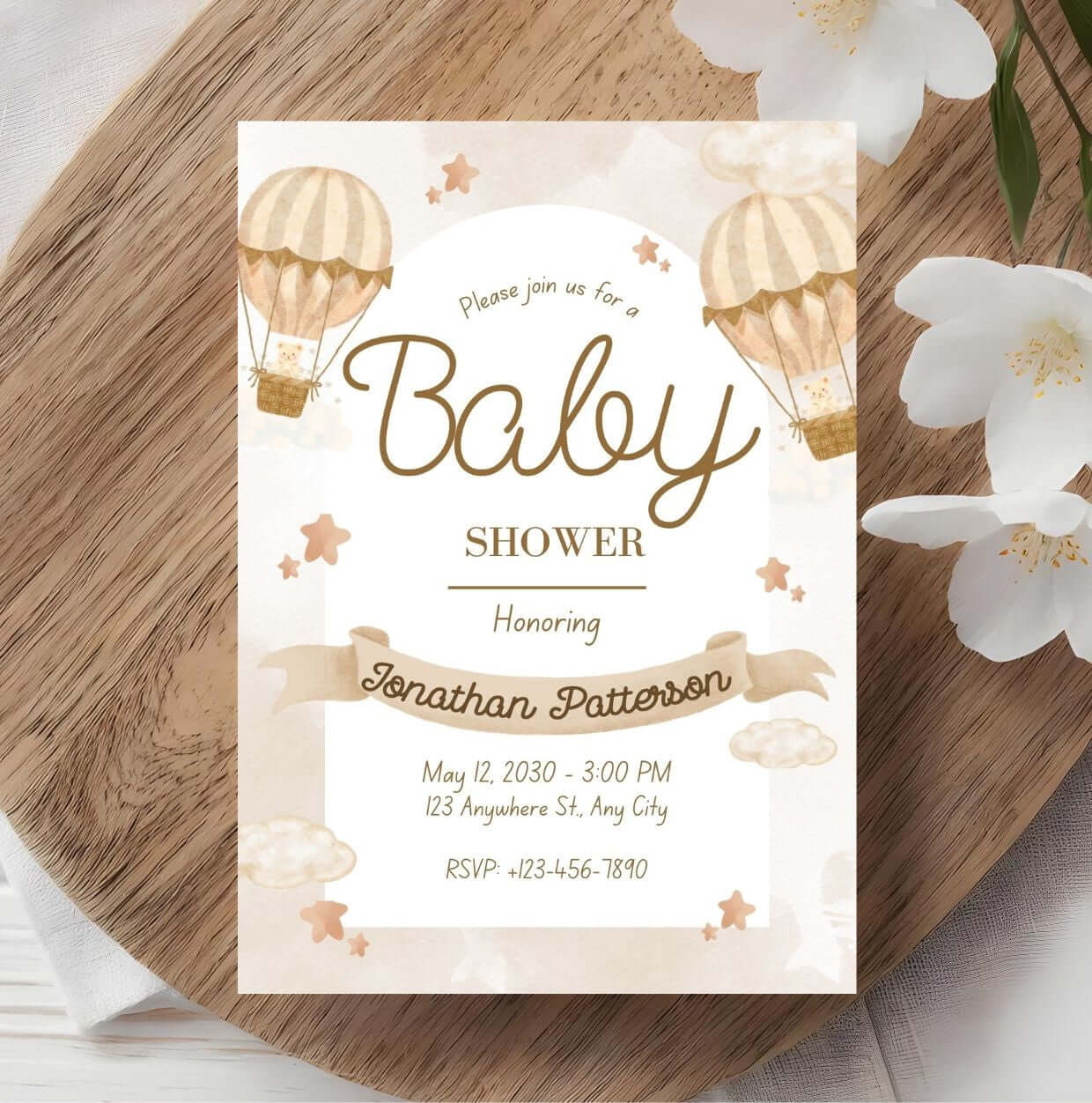Beige baby shower invitation with hot air balloon design, editable template for gender-neutral celebrations.