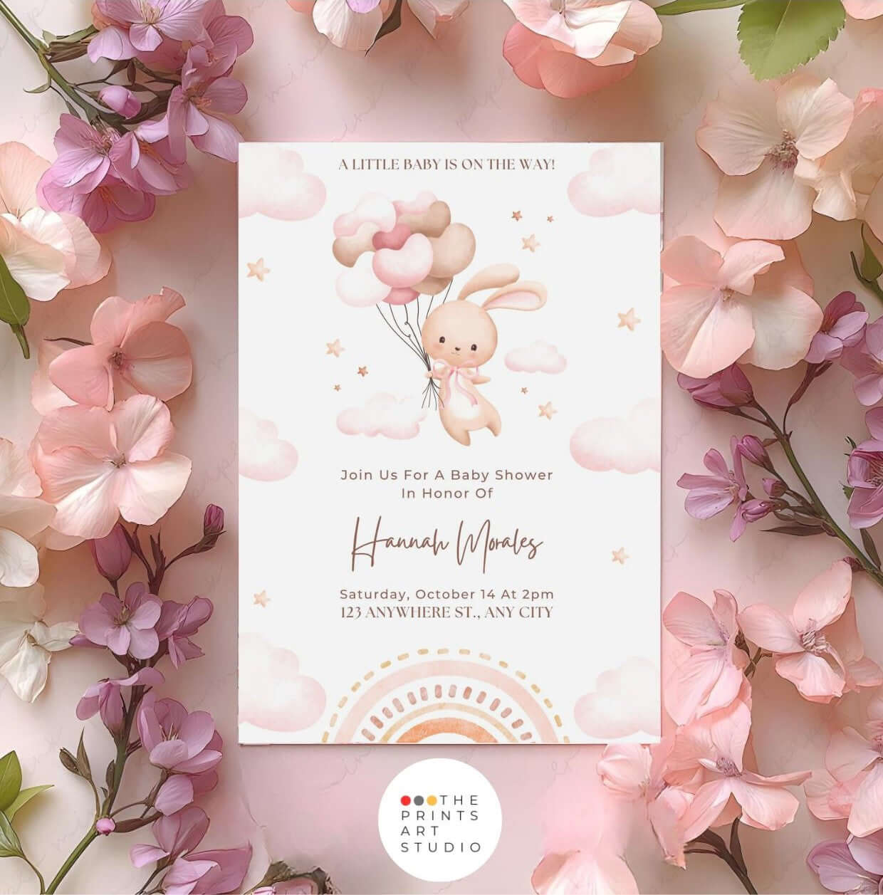 Bunny baby shower invitation with watercolor bunny and pink balloons surrounded by flowers, editable for pastel or gender-neutral themes.