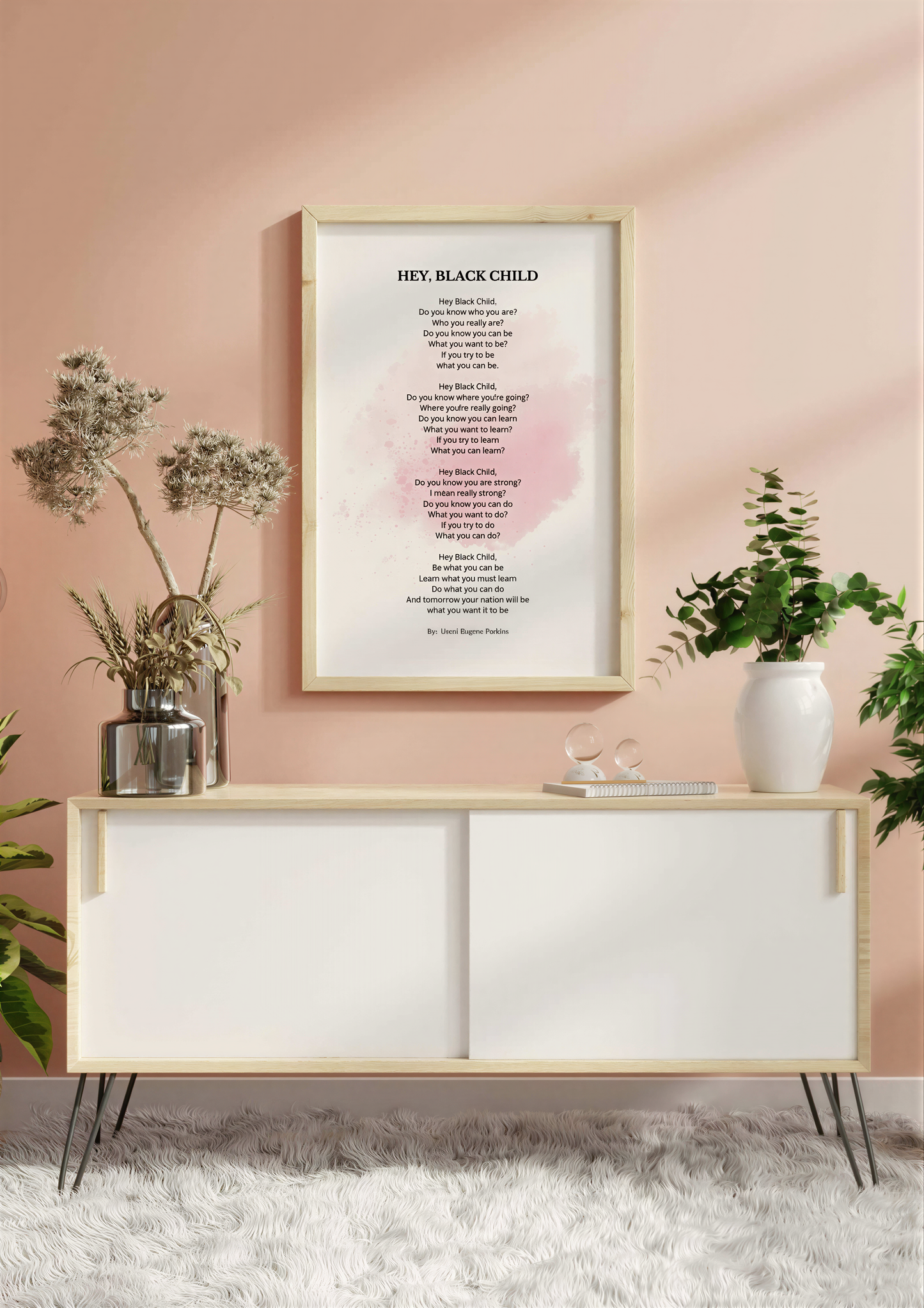 Hey Black Child Poem framed print displayed above a modern white cabinet in a stylish room setting.