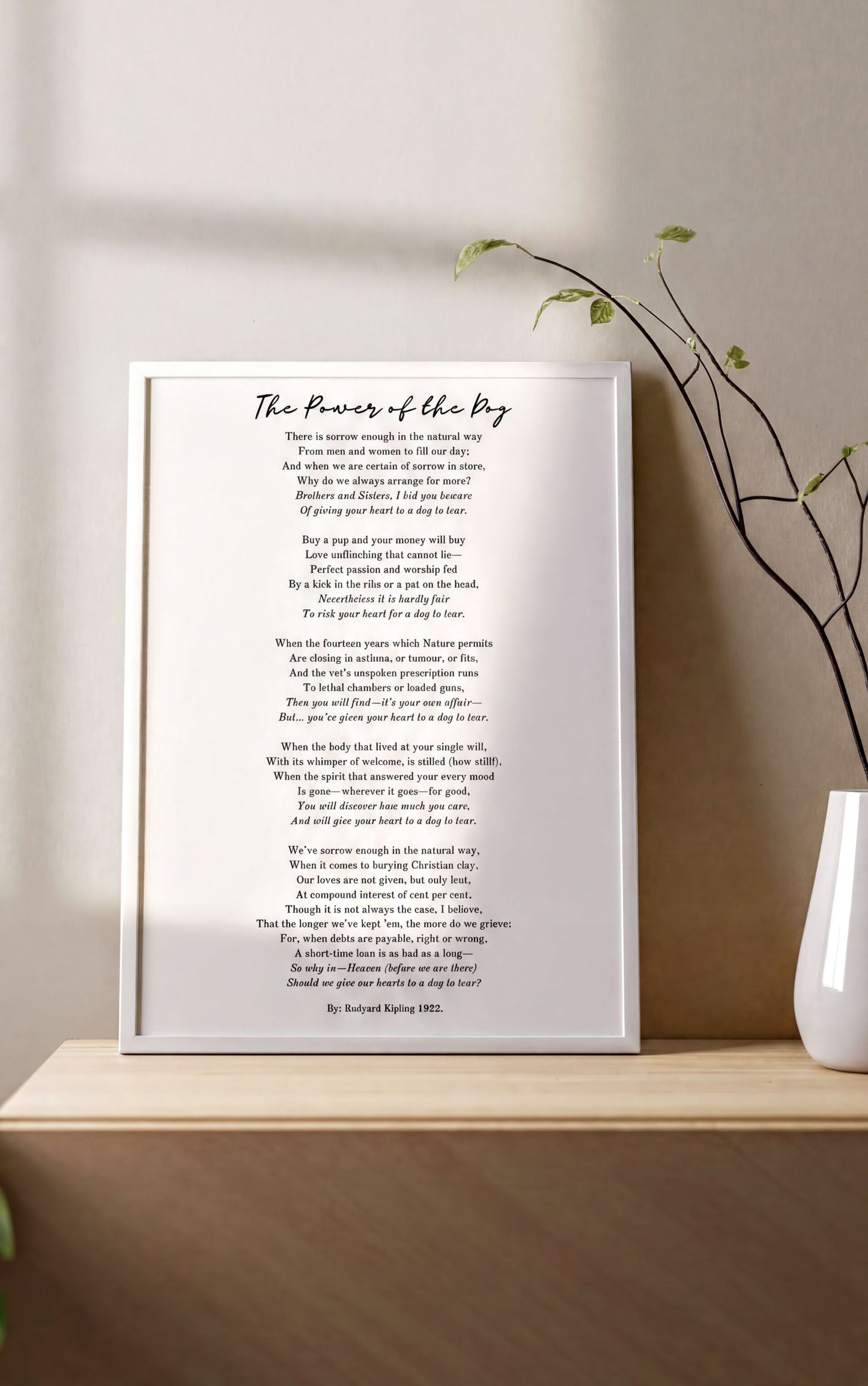 "The Power of the Dog by Rudyard Kipling – Heartfelt Pet Loss Poem Print" displayed on a wooden shelf with a plant.