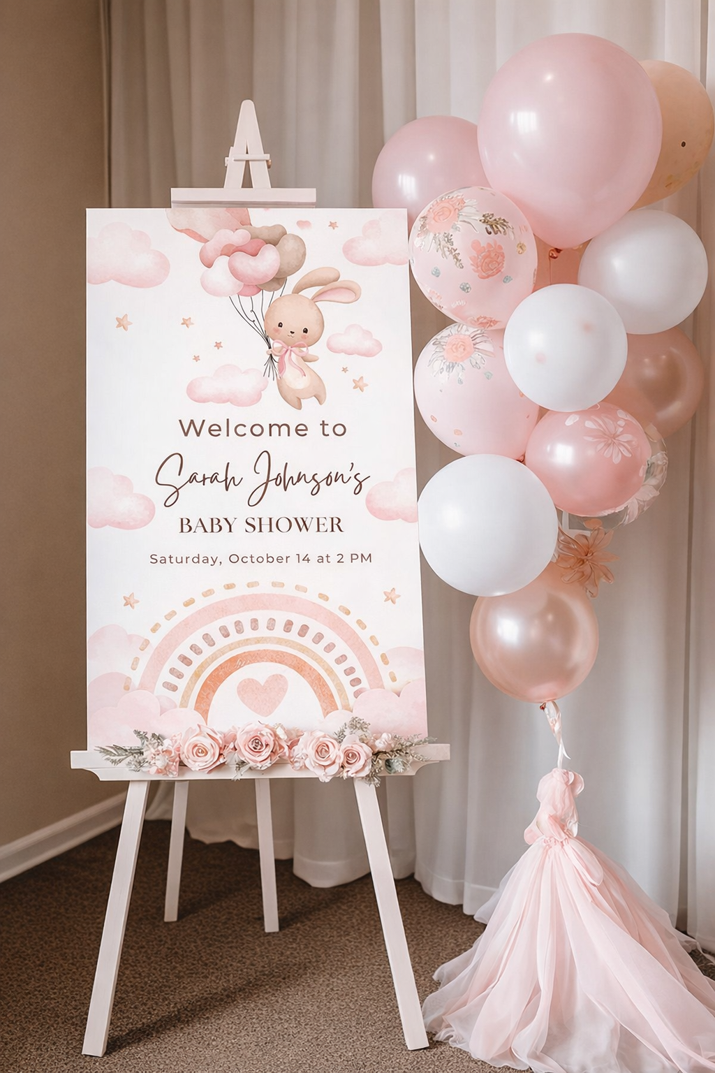 Baby shower welcome sign featuring a bunny with balloons, pastel colors, and decorative floral elements.