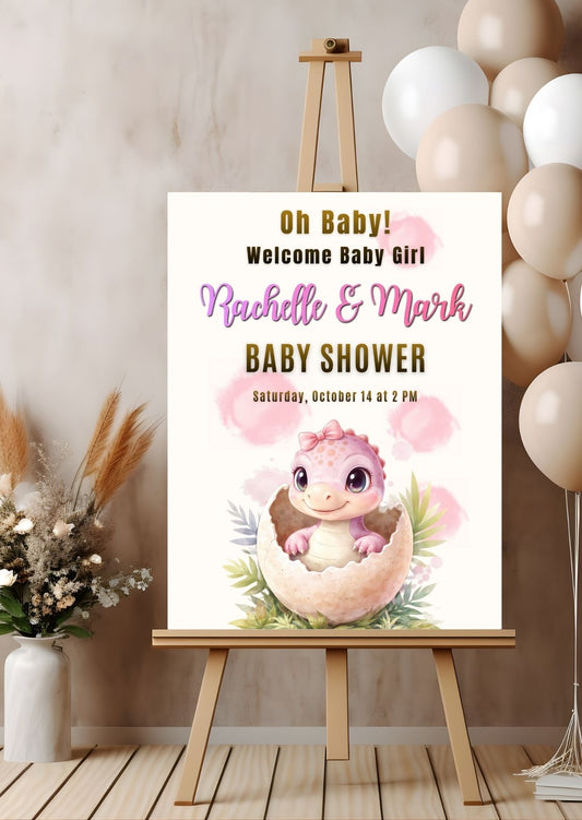 Girl baby shower welcome sign featuring a cute dinosaur hatching from an egg, celebrating Rachelle and Mark's baby shower.