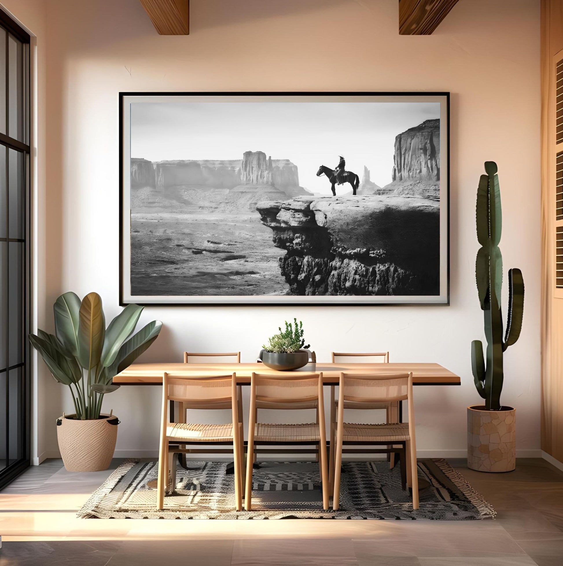 Western Wall Art Print in dining room, featuring black and white cowboy landscape with desert and rock formations.