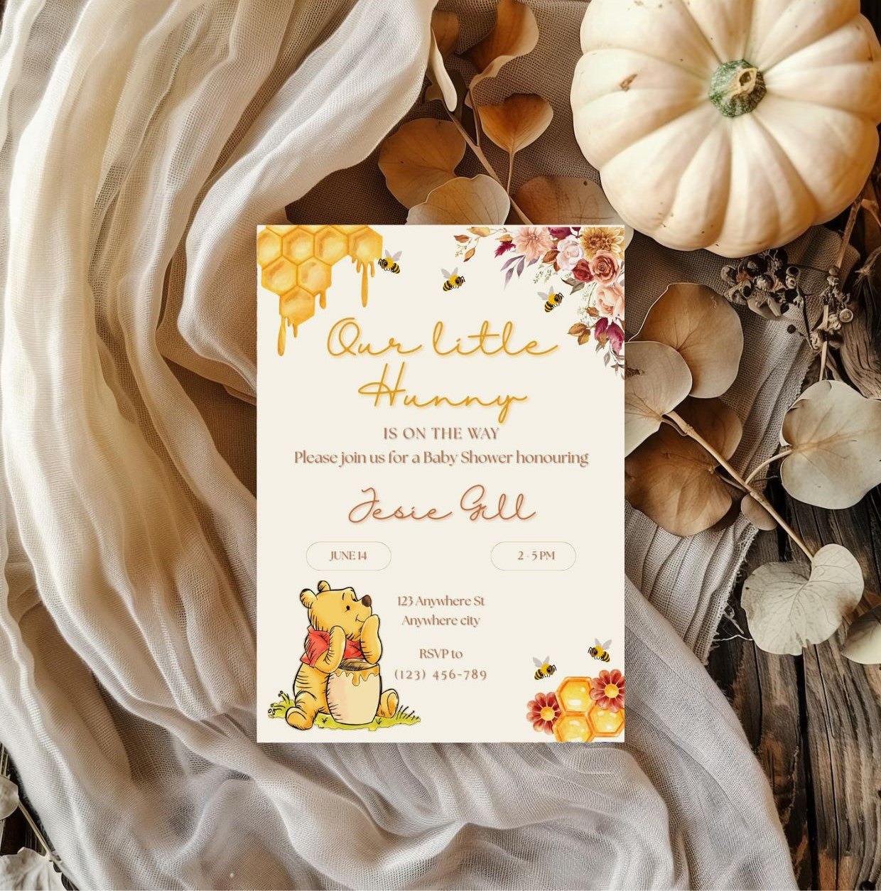 Winnie the Pooh baby shower invitation with autumn theme on white fabric and pumpkin decor