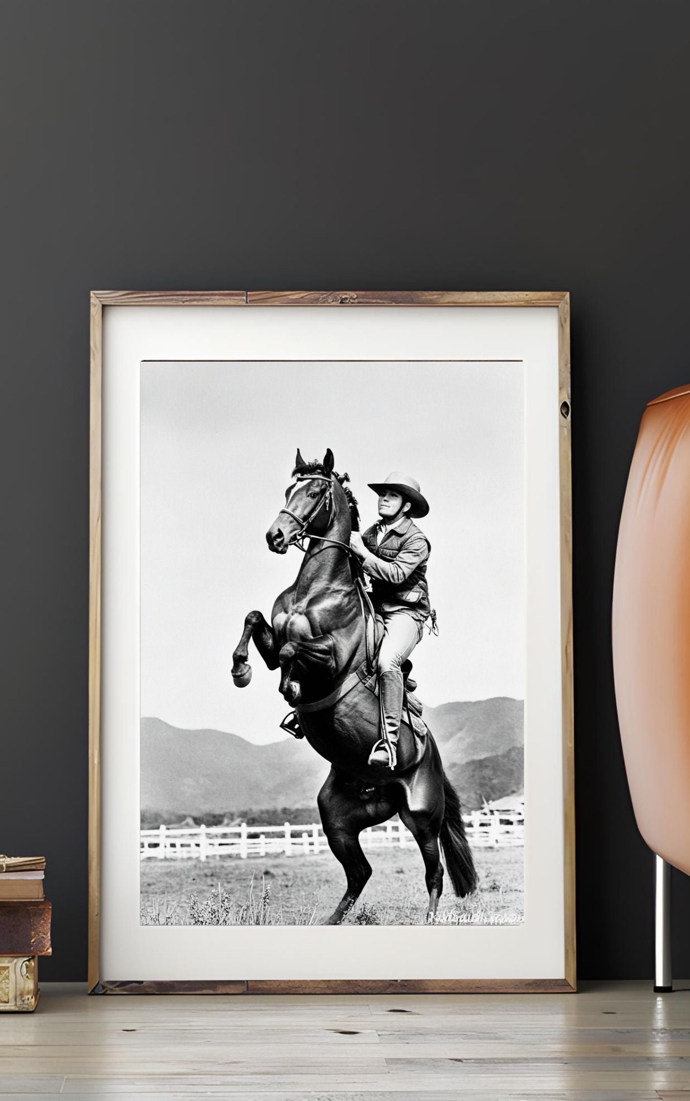 Western Wall Art featuring a black and white print of a rearing horse and cowboy, capturing the spirit of the American frontier.