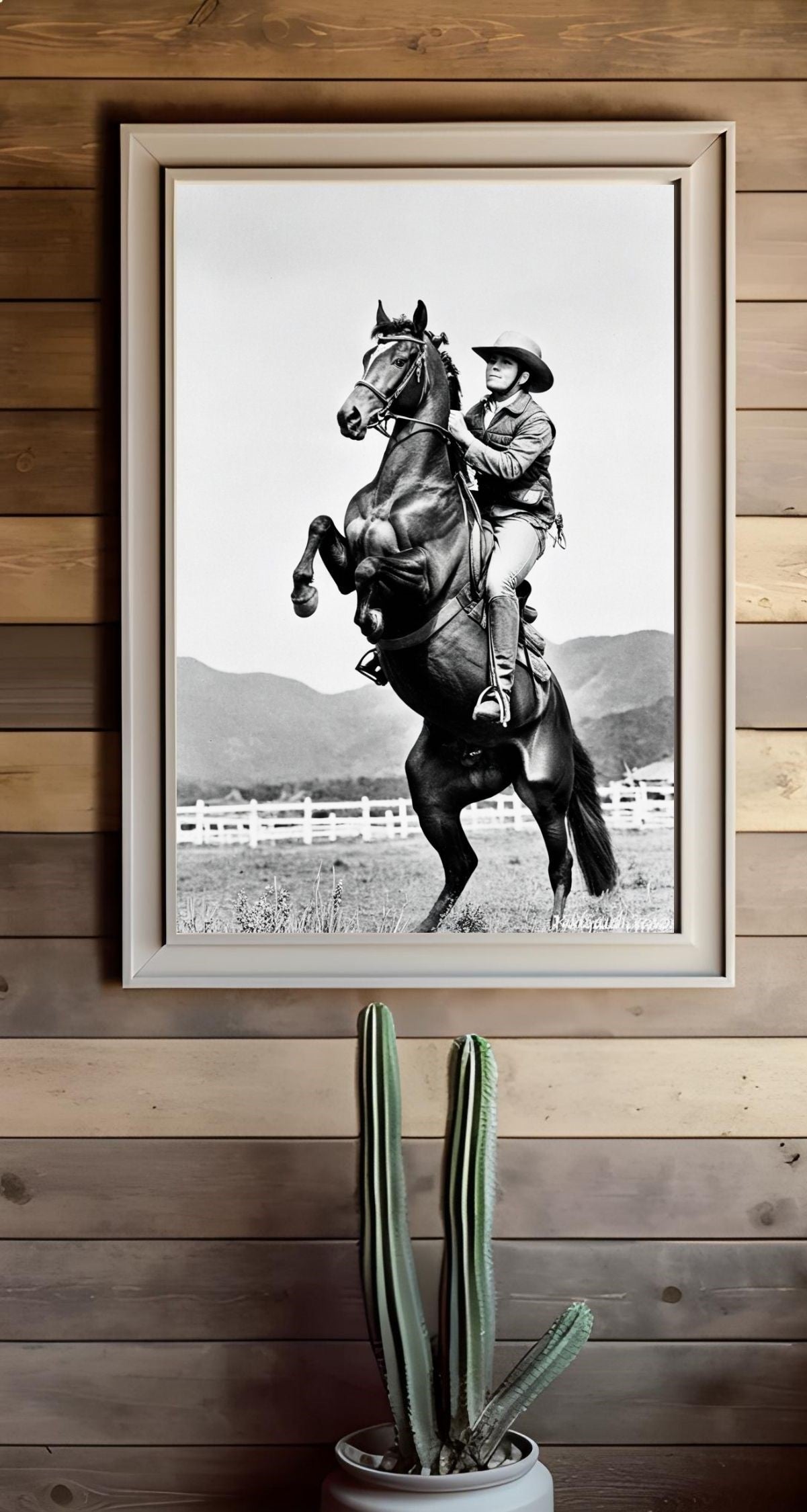 Western Wall Art featuring black and white cowboy print with a rearing horse, embodying frontier spirit and freedom.