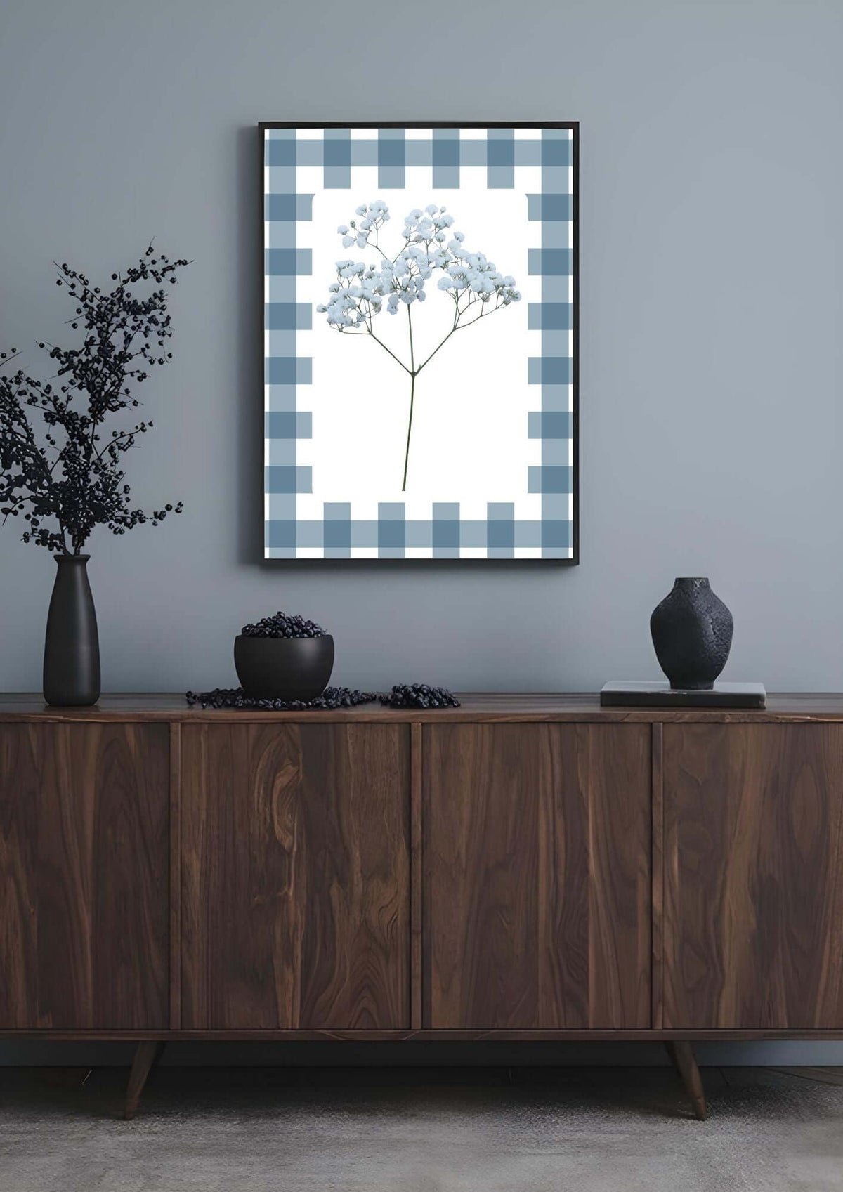Blue Gingham Baby's Breath Print with blue floral print in cottagecore design on a gray wall above a wooden sideboard