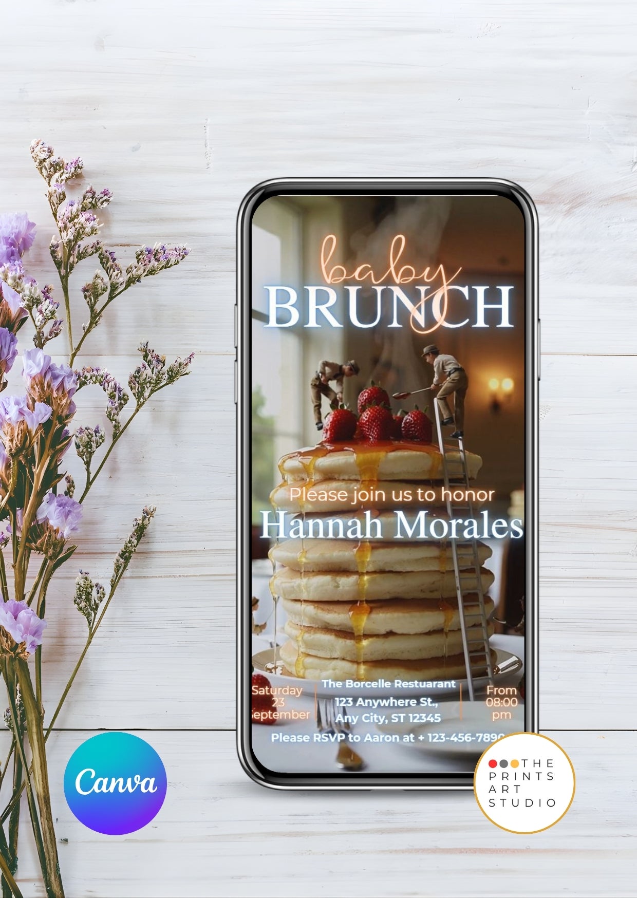 Baby Shower Video Invitation Dreamy Canva Editable template displayed on a phone with pancakes and flowers background.
