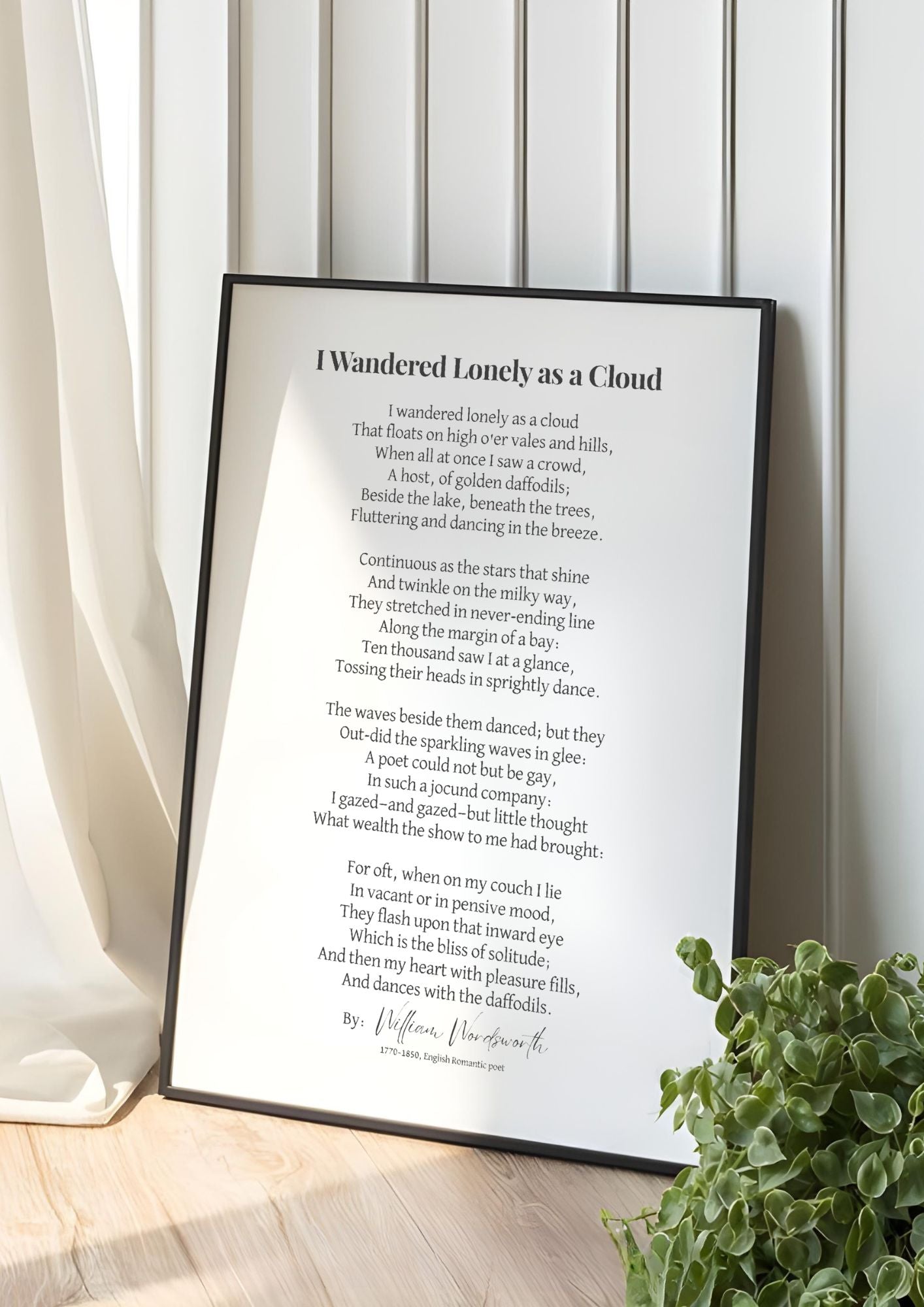 I Wandered Lonely as a Cloud Poem Print – Literary Wall Art in sunlight beside curtains and plant.