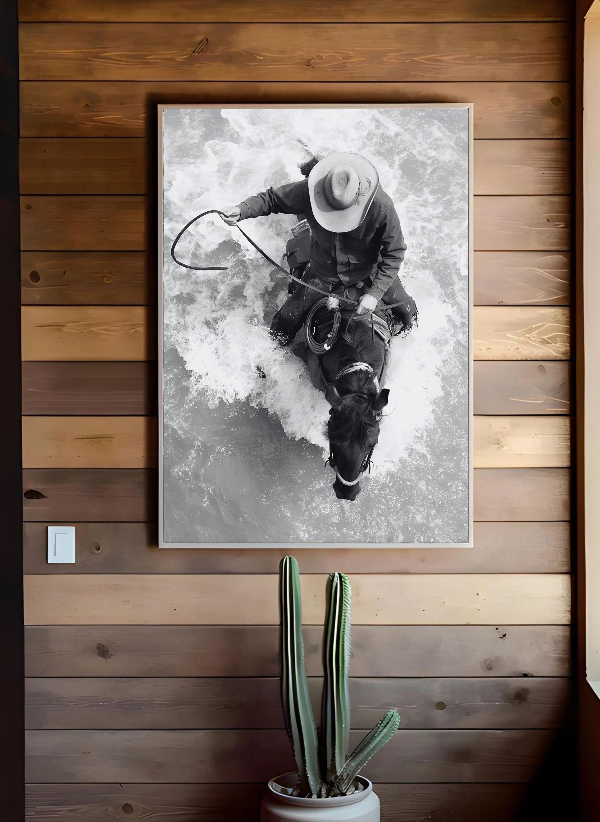 Western Horse Wall Art – Black and White Cowboy Print with a cowboy riding through water on a wooden wall display.