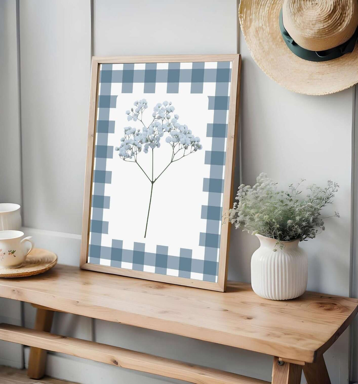 Blue Gingham Baby's Breath Print with blue floral design in cottagecore style displayed on a wooden bench
