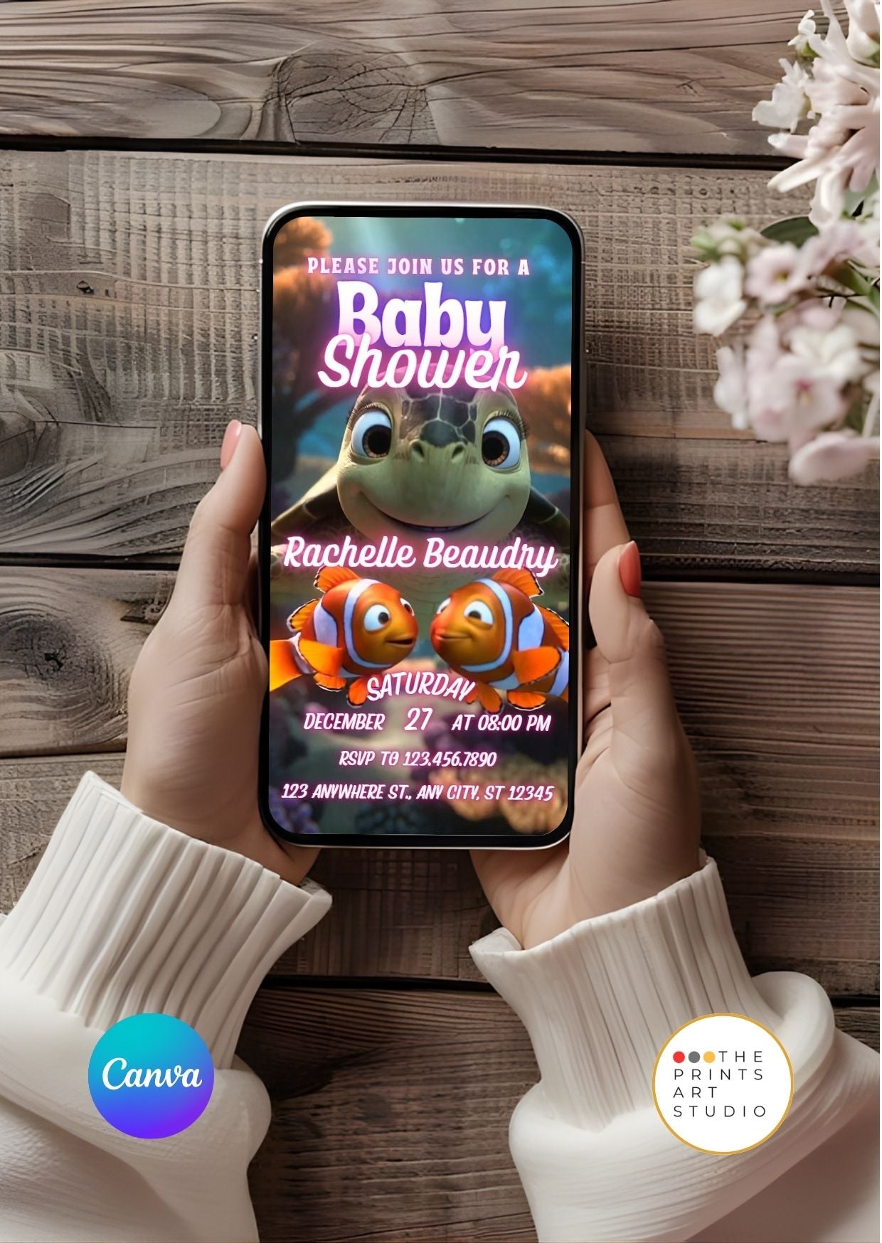 Person holding phone with Baby Shower Video Invitation Template in ocean theme displayed on screen.