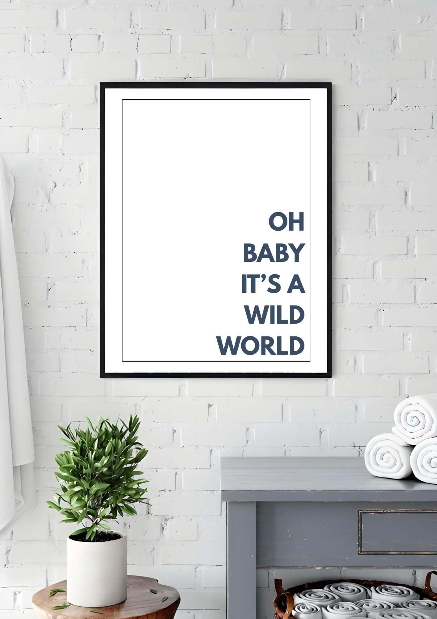 oh baby its a wild world wall art in minimalist style hanging on a white brick wall, perfect for modern home decor.