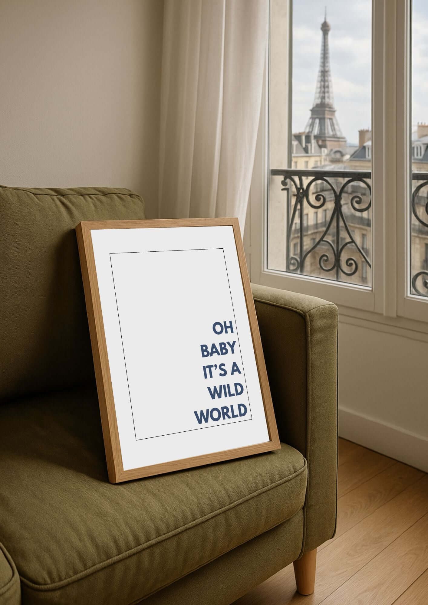 Oh baby its a wild world wall art in minimalist style on a couch, with a window view of a city in the background.