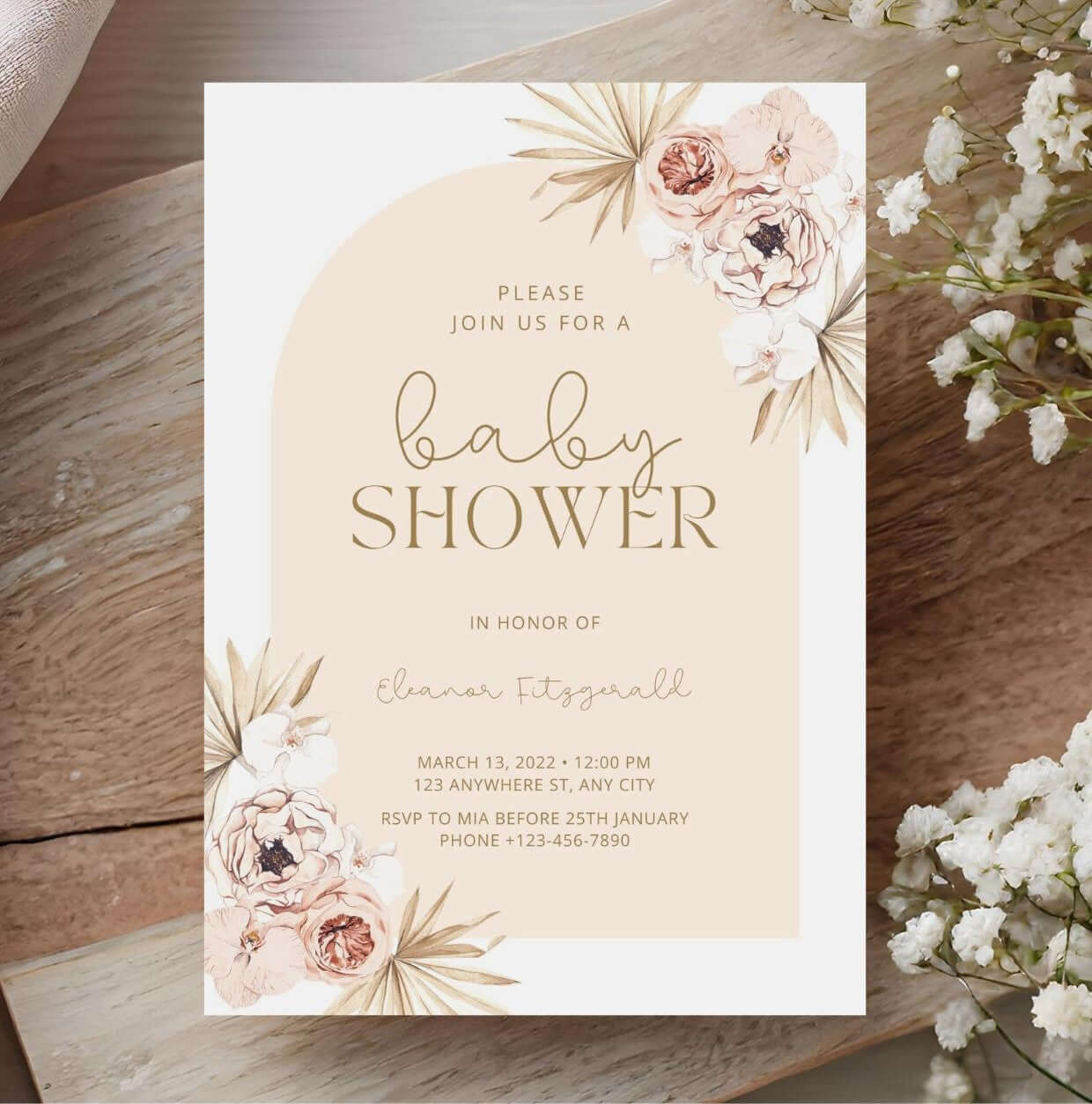 Pastel Boho Floral Baby Shower Invitation | Neutral Arch Editable Template | Digital Download displayed on a wooden table.