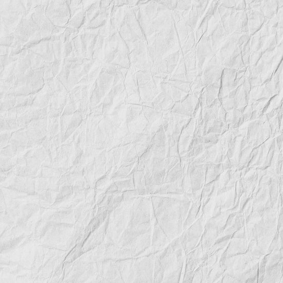 Crumpled white paper texture with visible creases and folds