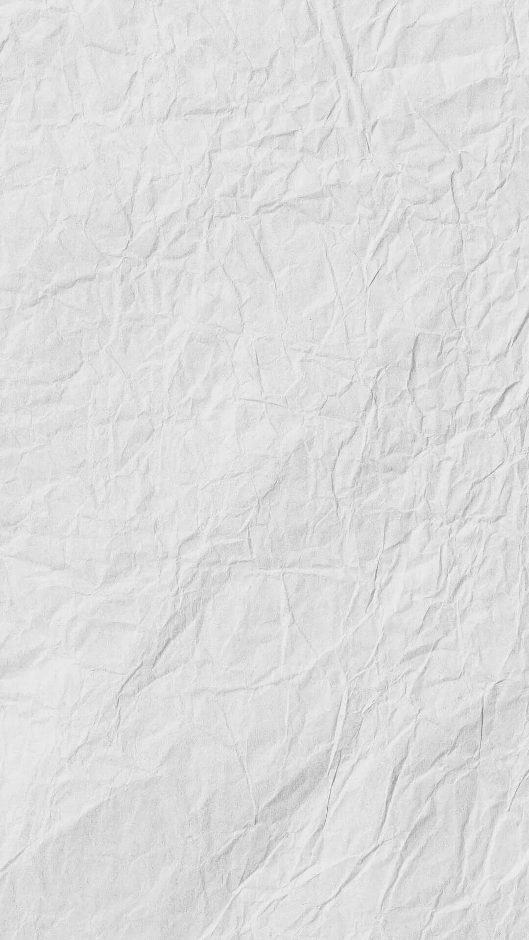 Close-up of wrinkled white paper texture background.