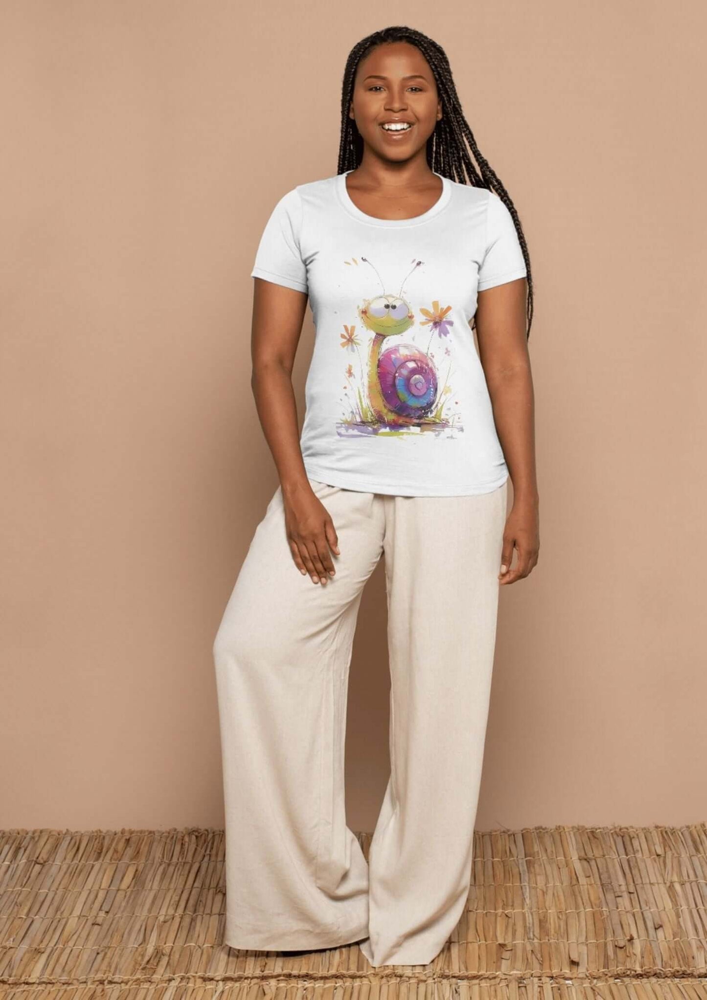 Woman wearing a snail watercolor t-shirt design, standing on wooden floor with a beige background.