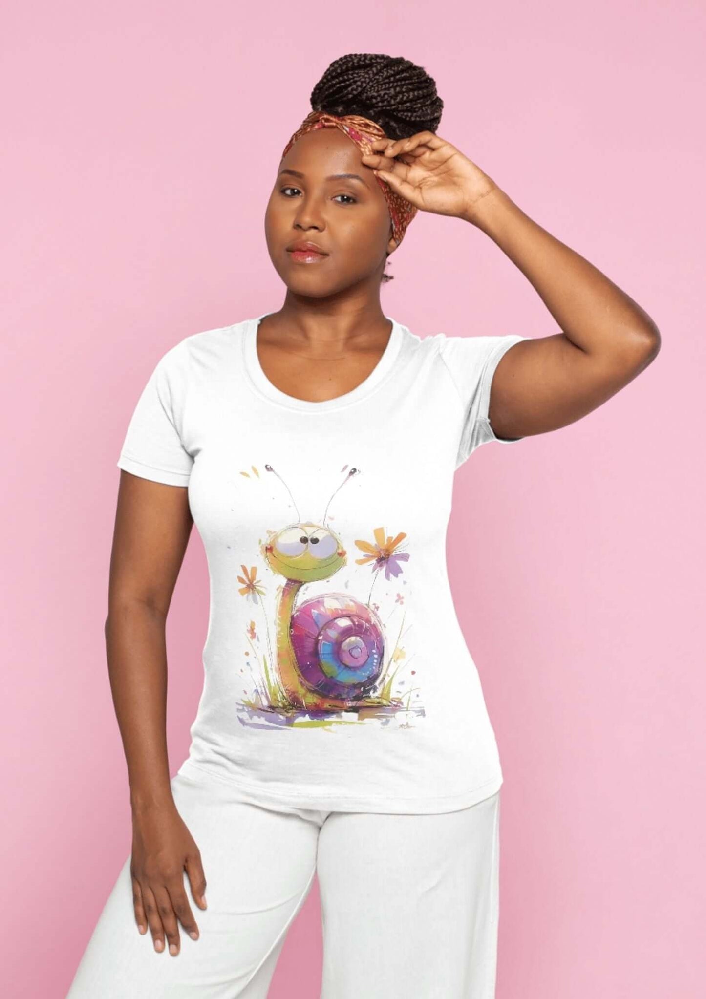 Woman wearing a white t-shirt with snail watercolor t-shirt design, showcasing colorful and cheerful snail artwork on pink background.