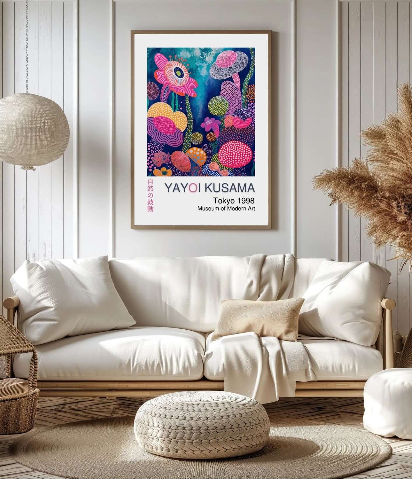 Yayoi Kusama digital art print hanging on wall above modern living room sofa, featuring vibrant floral abstract design.